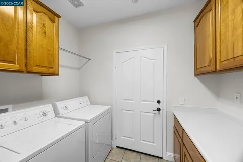 a bedroom with a bed and a lamp on table