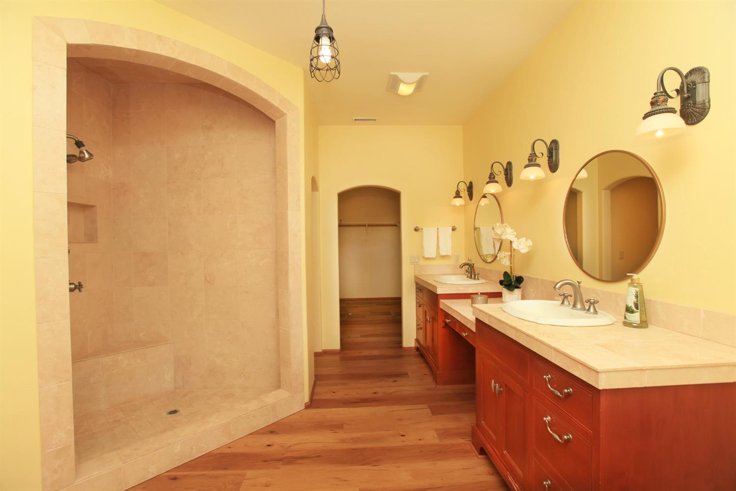 1010 El Toro Road Ojai, CA 93023 - Photo 19 of 49 a bathroom with a double vanity sink mirror and shower