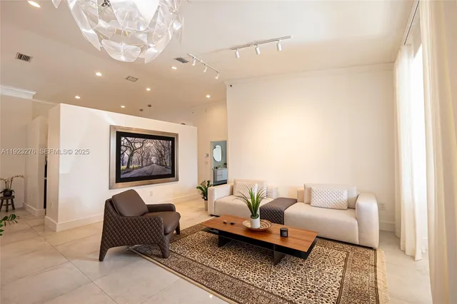 a living room with furniture and a rug