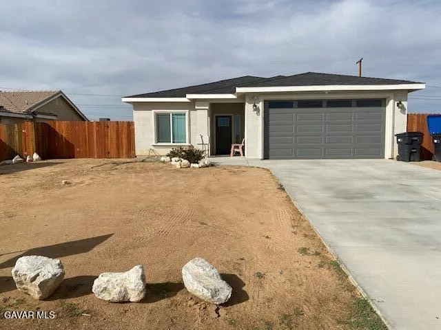 a front view of a house with table and chairs