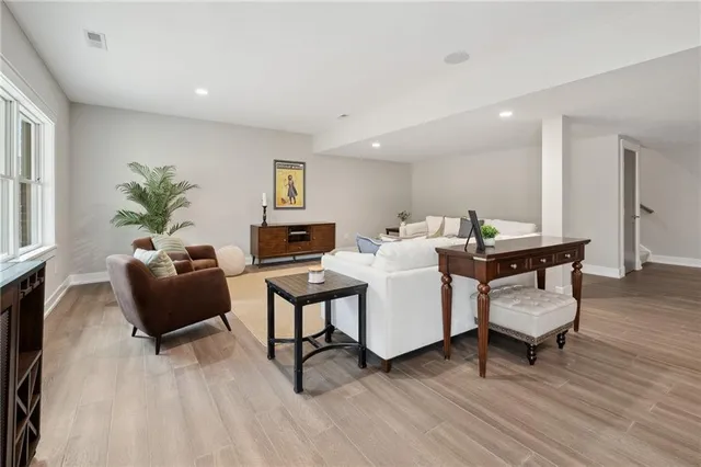 a living room with furniture and a large window