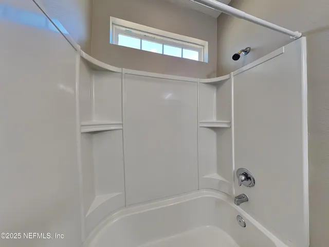 a bathroom with a bathtub