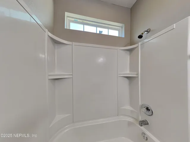 a bathroom with a bathtub