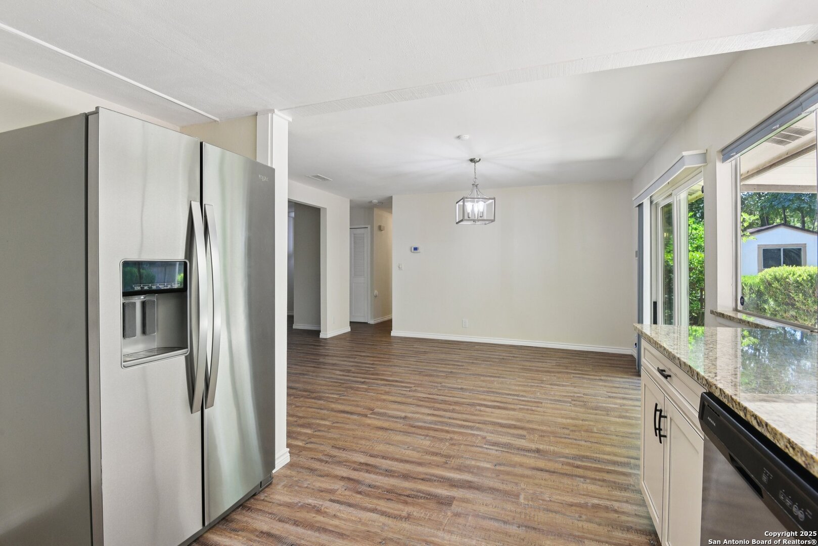 6630 Spring Hollow Street San Antonio, TX 78249 - Photo 19 of 40 a view of a kitchen with a sink and refrigerator