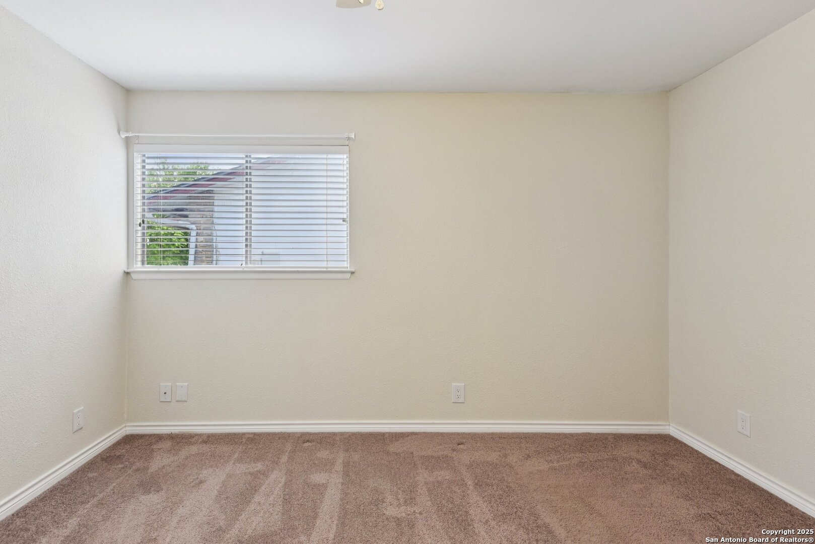 6630 Spring Hollow Street San Antonio, TX 78249 - Photo 32 of 40 an empty room with a window