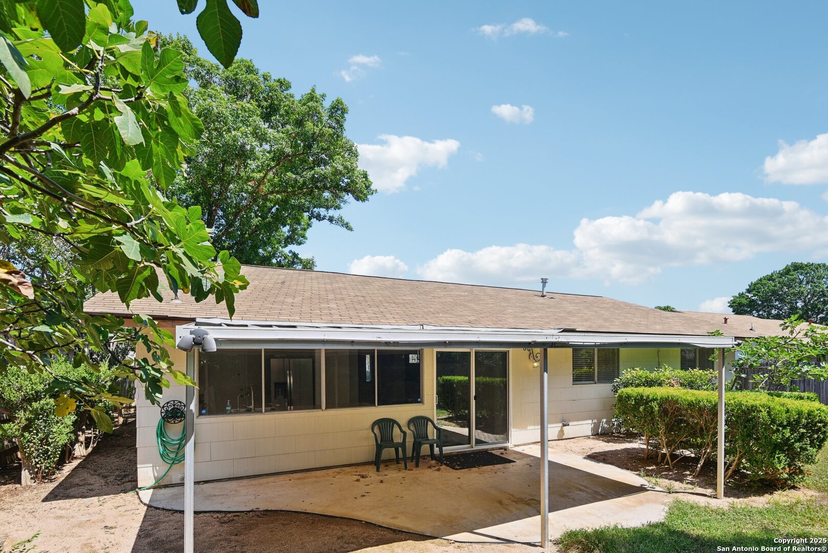 6630 Spring Hollow Street San Antonio, TX 78249 - Photo 39 of 40 a view of a house with backyard sitting area and garden