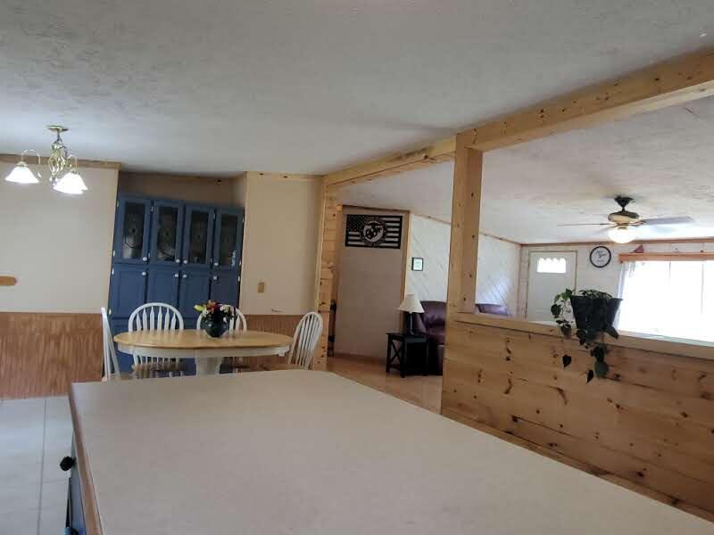 6414 West 18 Road Mesick, MI 49668 - Photo 11 of 53 Center Island with living room view