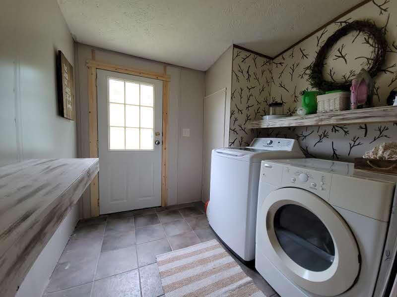 6414 West 18 Road Mesick, MI 49668 - Photo 29 of 53 Laundry with outdoor access