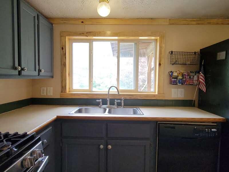 6414 West 18 Road Mesick, MI 49668 - Photo 8 of 53 Kitchen sink with a garden view