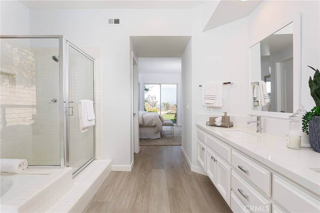 29672 Teracina Laguna Niguel, CA 92677 - Photo 14 of 35 a spacious en suite bathroom with a double vanity sink and mirror