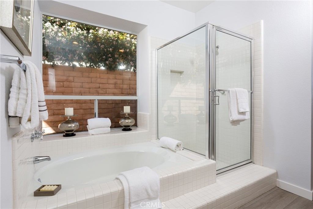 29672 Teracina Laguna Niguel, CA 92677 - Photo 15 of 35 a bathroom with a tub and a sink