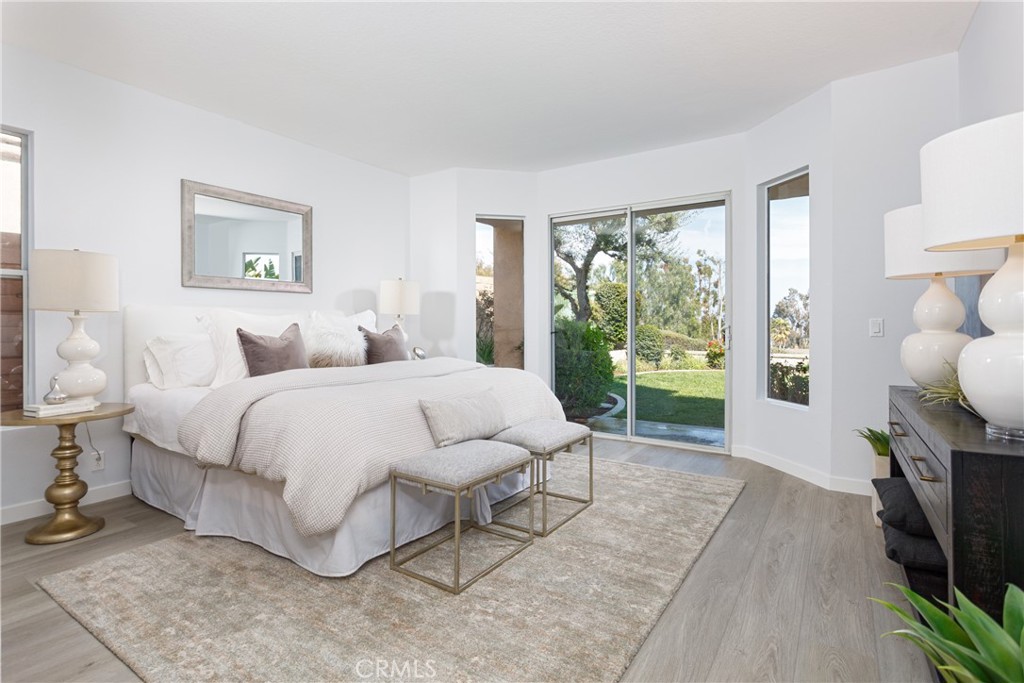 29672 Teracina Laguna Niguel, CA 92677 - Photo 17 of 35 a spacious bedroom with a bed and a window