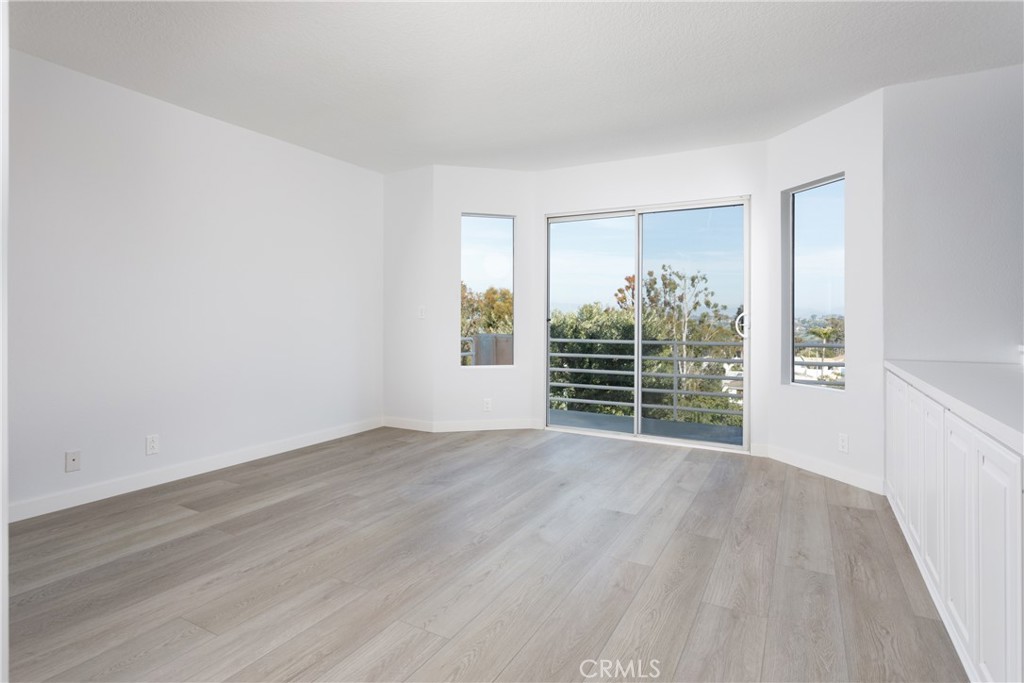 29672 Teracina Laguna Niguel, CA 92677 - Photo 28 of 35 wooden floor in an empty room with a window