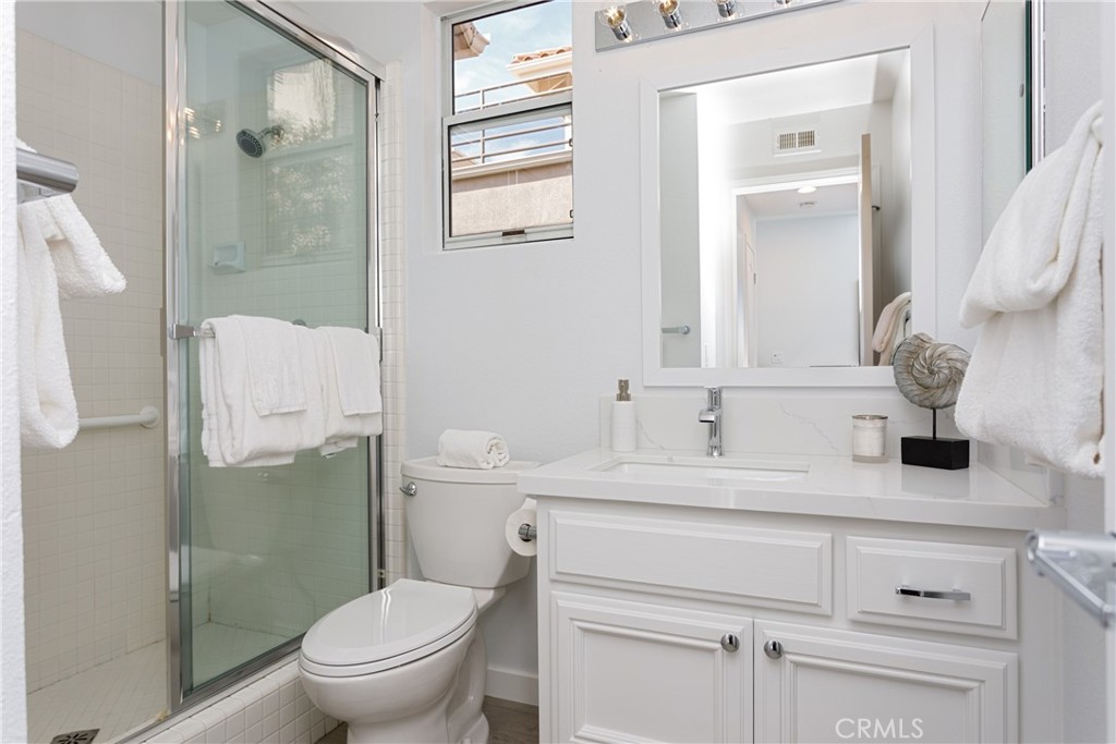 29672 Teracina Laguna Niguel, CA 92677 - Photo 8 of 35 a bathroom with a granite countertop sink toilet and shower