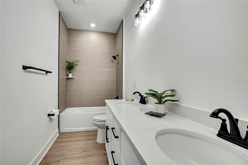 6589 Freeport Drive Spring Hill, FL 34608 - Photo 43 of 63 a bathroom with a sink and mirror