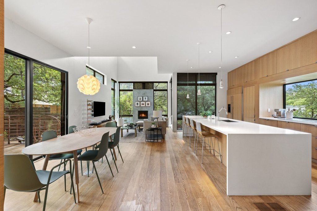 801 The High Road Austin, TX 78746 - Photo 6 of 40 a view of a dining room with furniture window and wooden floor