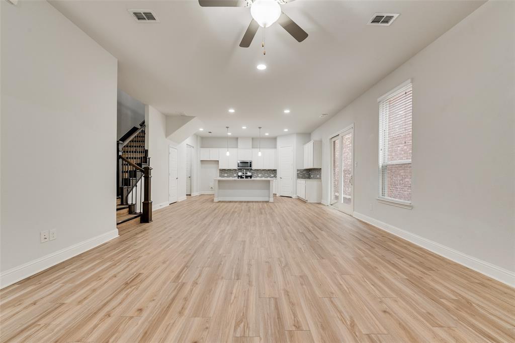 628 Ansley Way Allen, TX 75013 - Photo 9 of 20 Spacious open-concept living area featuring wood-finish flooring, recessed lighting, and a ceiling fan