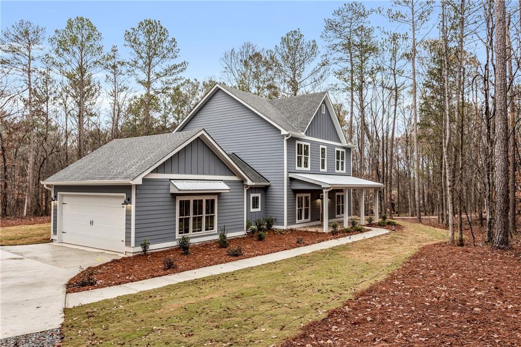 1590 Lower Apalachee Road Madison, GA 30650 - Photo 1 of 1 a front view of a house with a yard
