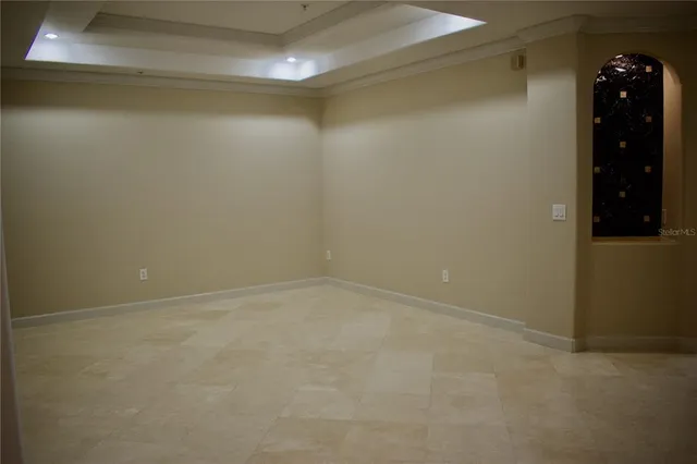 a view of a kitchen with refrigerator and a counter top space