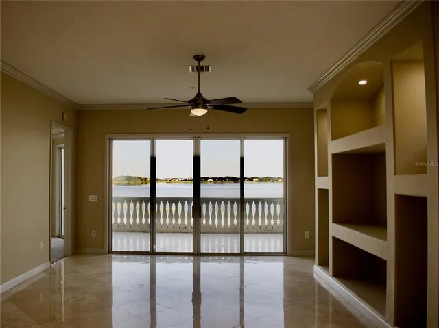 a kitchen with granite countertop white cabinets and stainless steel appliances