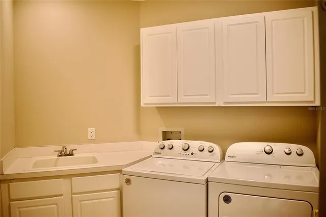 an aerial view of a houses with ocean view