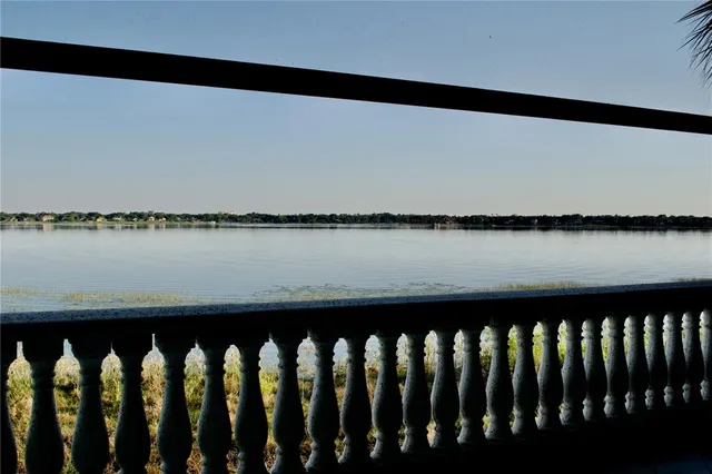 a view of a lake with a big yard