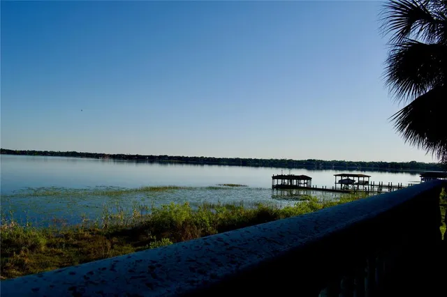 an empty room with a empty space and windows