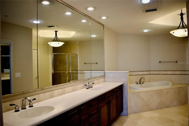 a bathroom with a granite countertop window