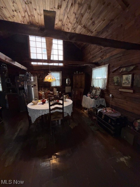 15639 Grove Road Southwest Port Washington, OH 43837 - Photo 17 of 31 Dining area featuring wood walls, dark wood finished floors, and wood ceiling