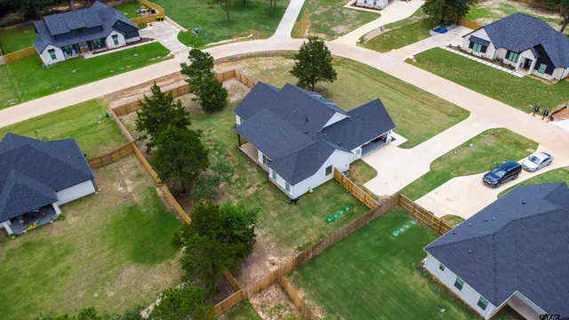 an aerial view of house with yard