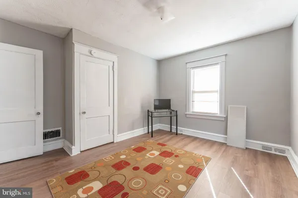 a furnished livingroom with a window