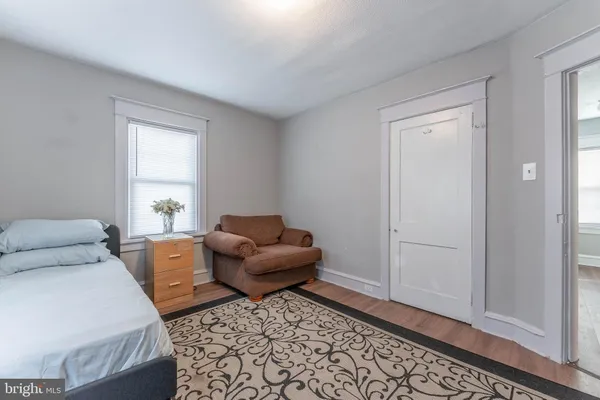 a bedroom with furniture and a window