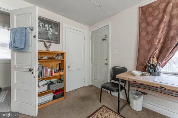 a white toilet sitting next to a bathroom sink