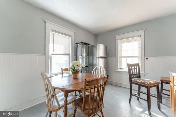 a view of a dining room with furniture and window