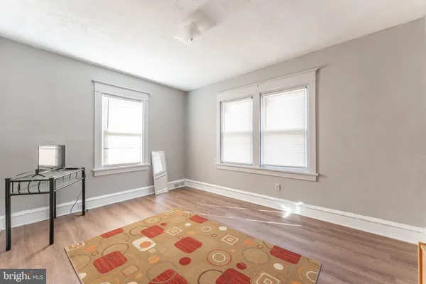a living room with a couch and a window