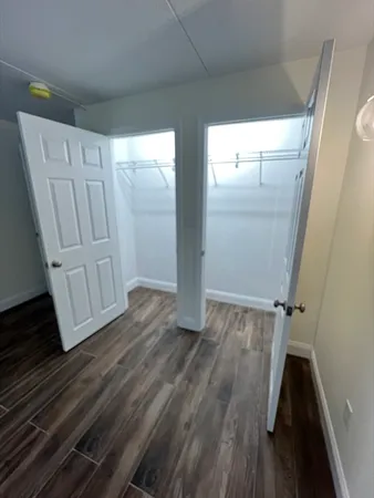 a view of front door with wooden floor