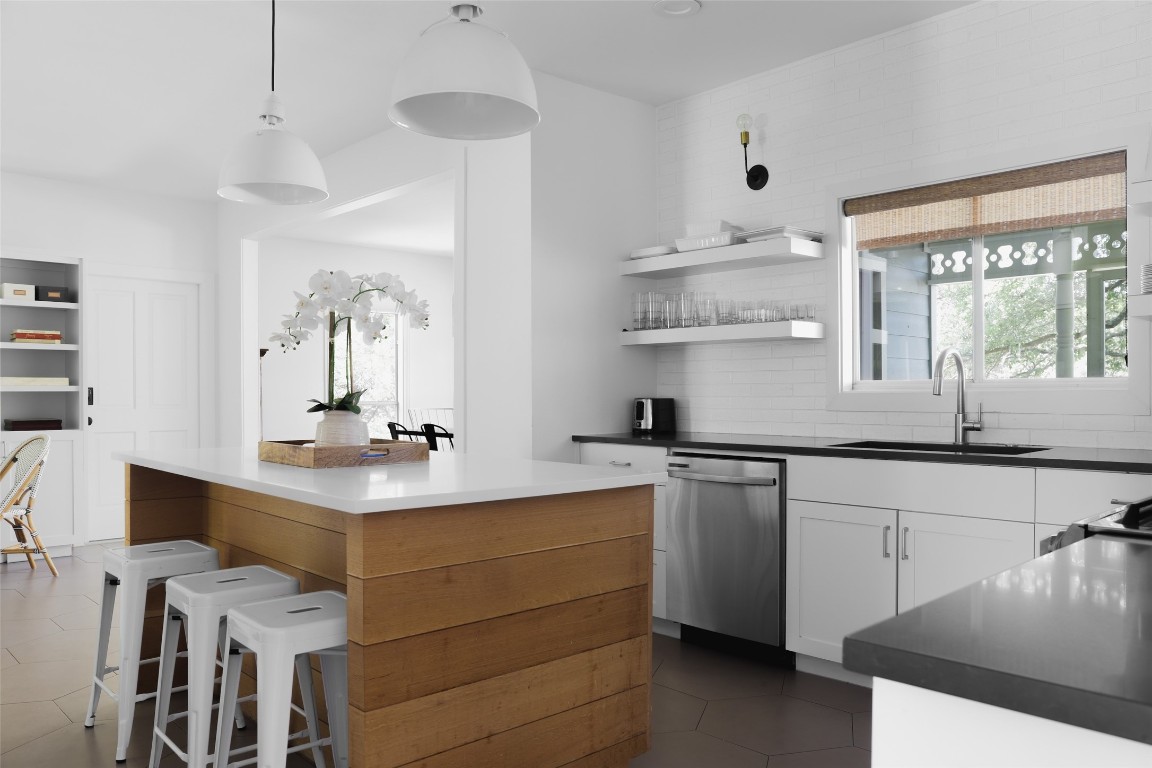 11505 Southwest Oaks Austin, TX 78737 - Photo 11 of 38 a kitchen with a sink cabinets and window
