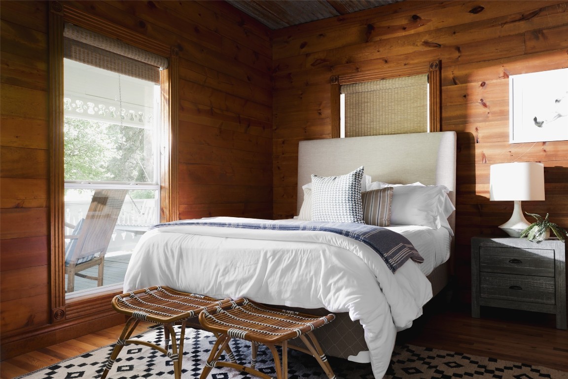 11505 Southwest Oaks Austin, TX 78737 - Photo 17 of 38 a bedroom with a bed and wooden floor