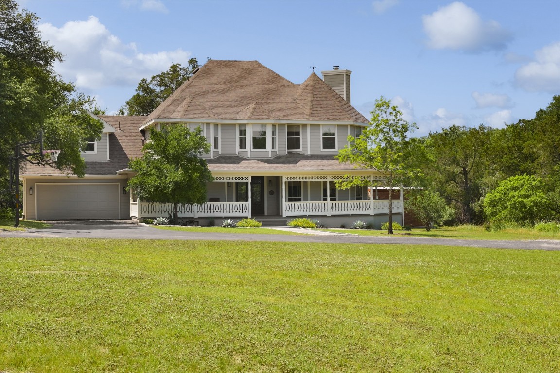 11505 Southwest Oaks Austin, TX 78737 - Photo 2 of 38 a front view of a house with swimming pool having outdoor seating
