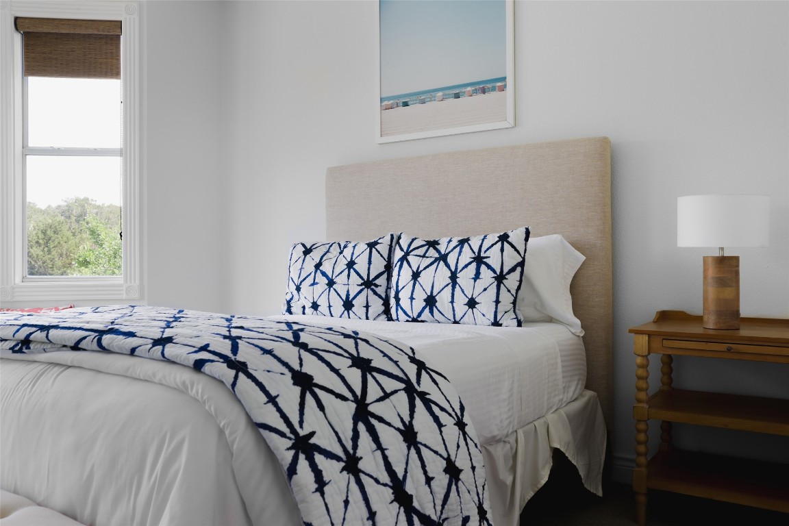 11505 Southwest Oaks Austin, TX 78737 - Photo 21 of 38 a bedroom with a bed and a window