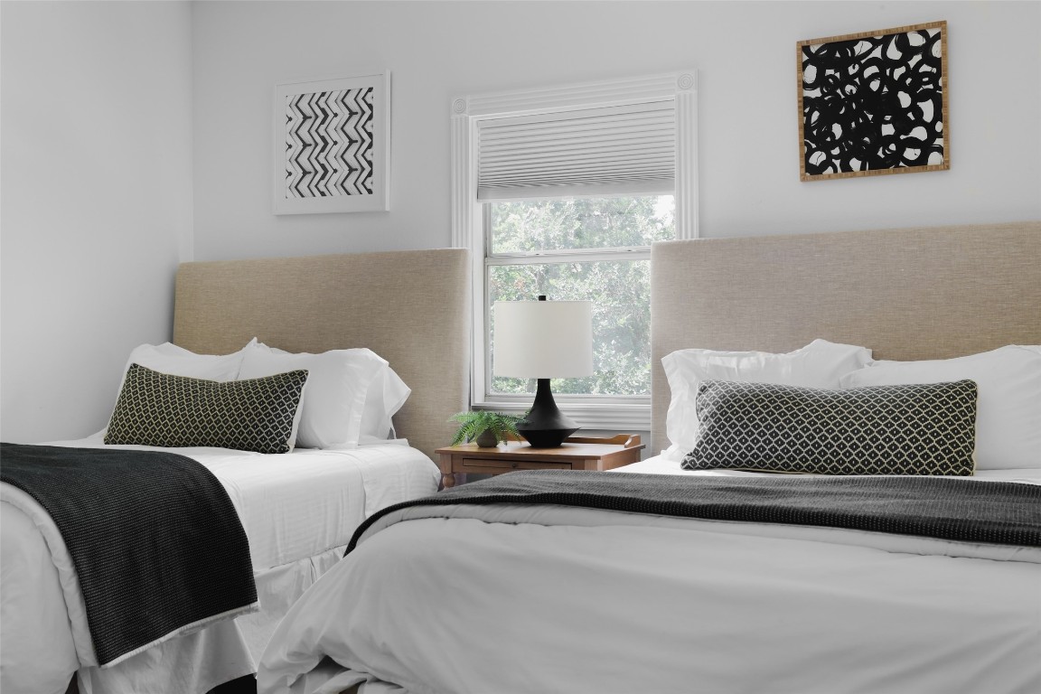 11505 Southwest Oaks Austin, TX 78737 - Photo 24 of 38 a bedroom with a bed and a painting on the wall