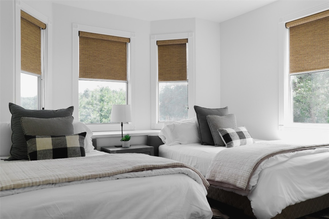 11505 Southwest Oaks Austin, TX 78737 - Photo 28 of 38 a bedroom with two beds and large windows