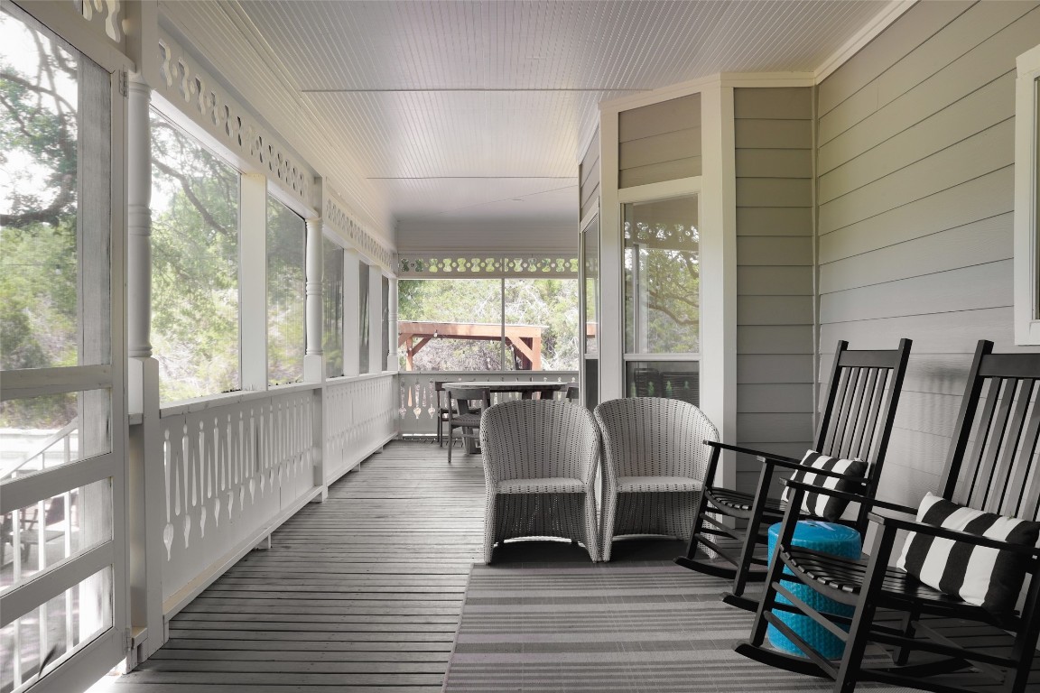 11505 Southwest Oaks Austin, TX 78737 - Photo 30 of 38 a view of a dining room with furniture window and wooden floor