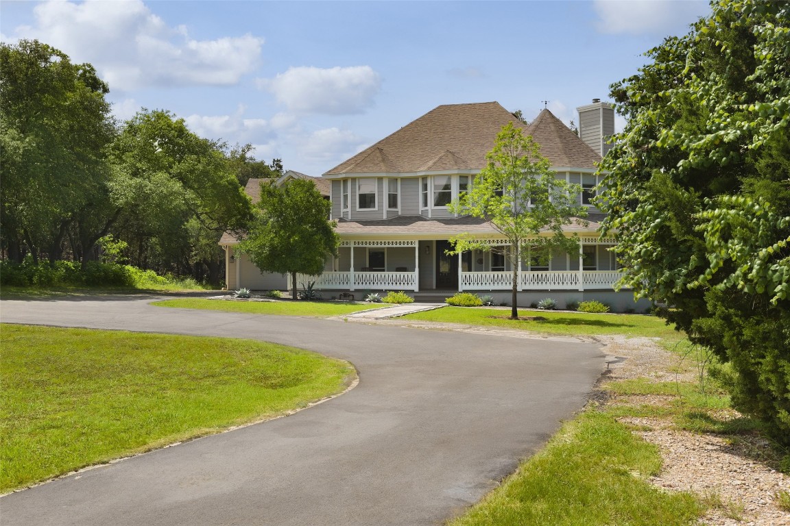 11505 Southwest Oaks Austin, TX 78737 - Photo 3 of 38 a view of a house with swimming pool and a yard