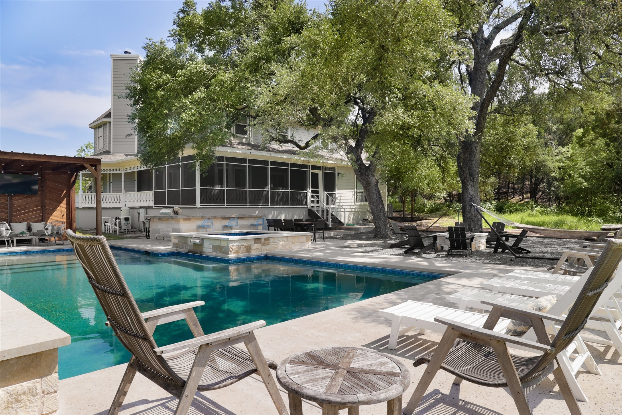 11505 Southwest Oaks Austin, TX 78737 - Photo 34 of 38 a view of a house with backyard sitting area and swimming pool