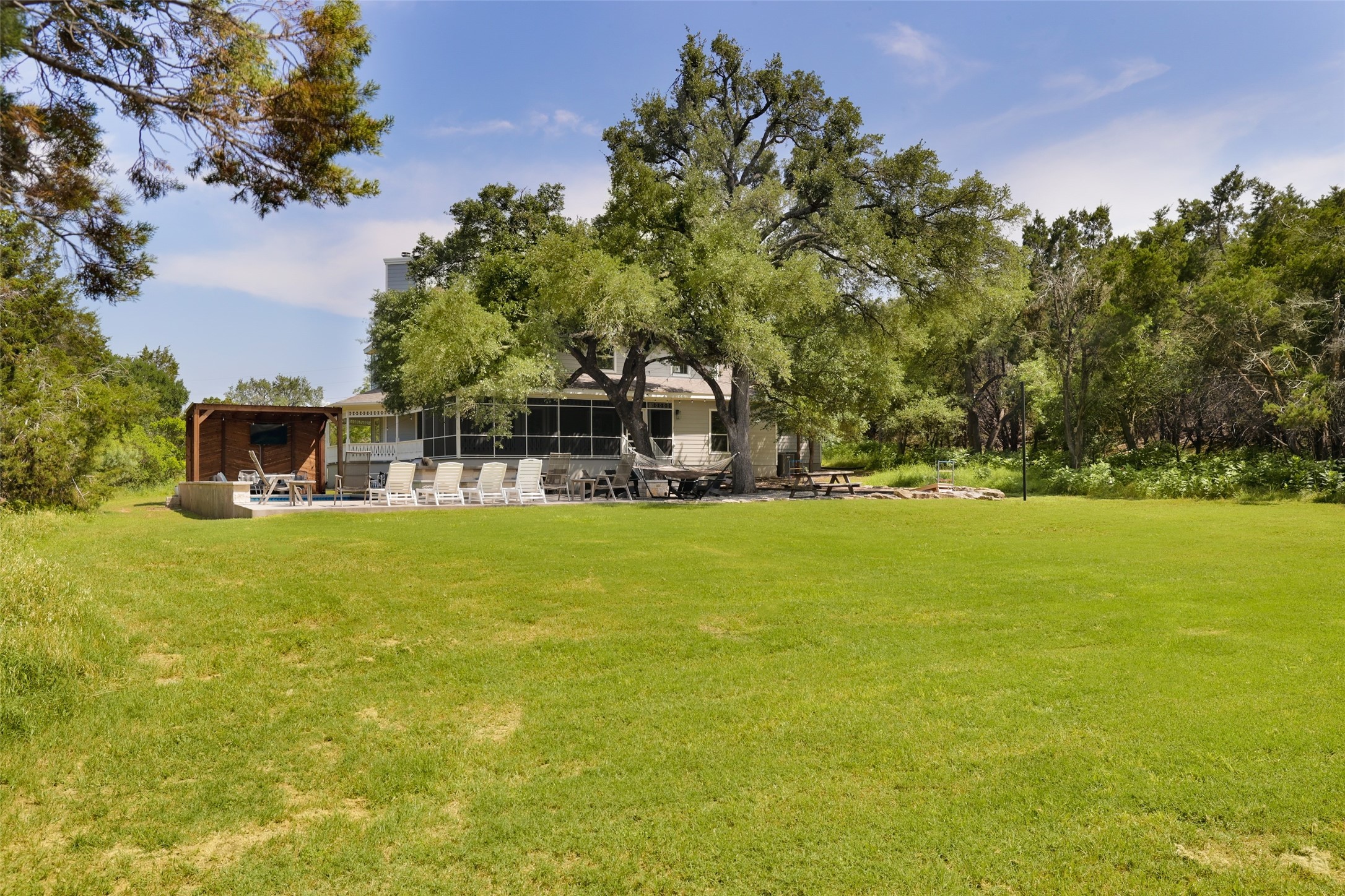 11505 Southwest Oaks Austin, TX 78737 - Photo 37 of 38 a house view with swimming pool in front of it