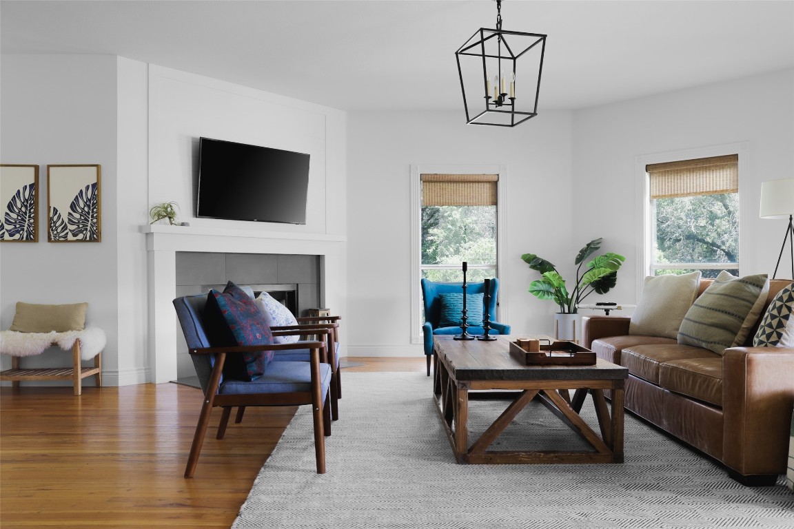11505 Southwest Oaks Austin, TX 78737 - Photo 7 of 38 a living room with furniture fireplace and a flat screen tv
