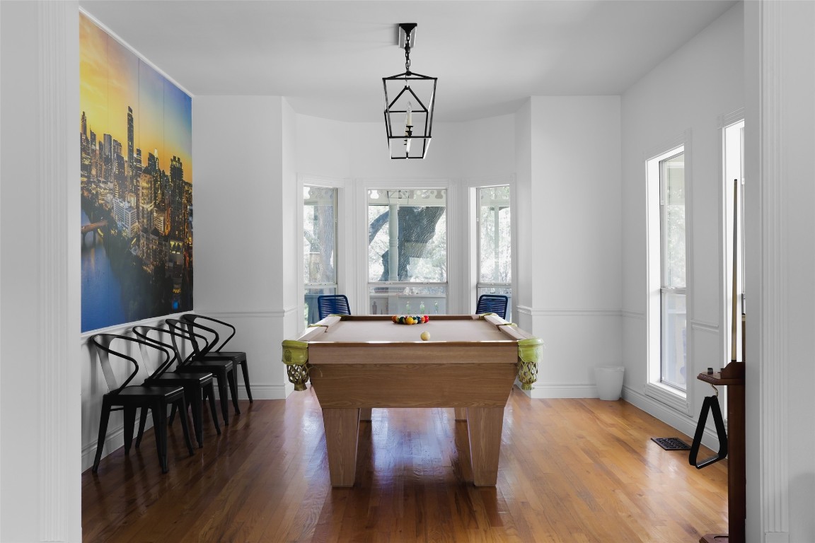11505 Southwest Oaks Austin, TX 78737 - Photo 10 of 38 a dining room with furniture window and wooden floor