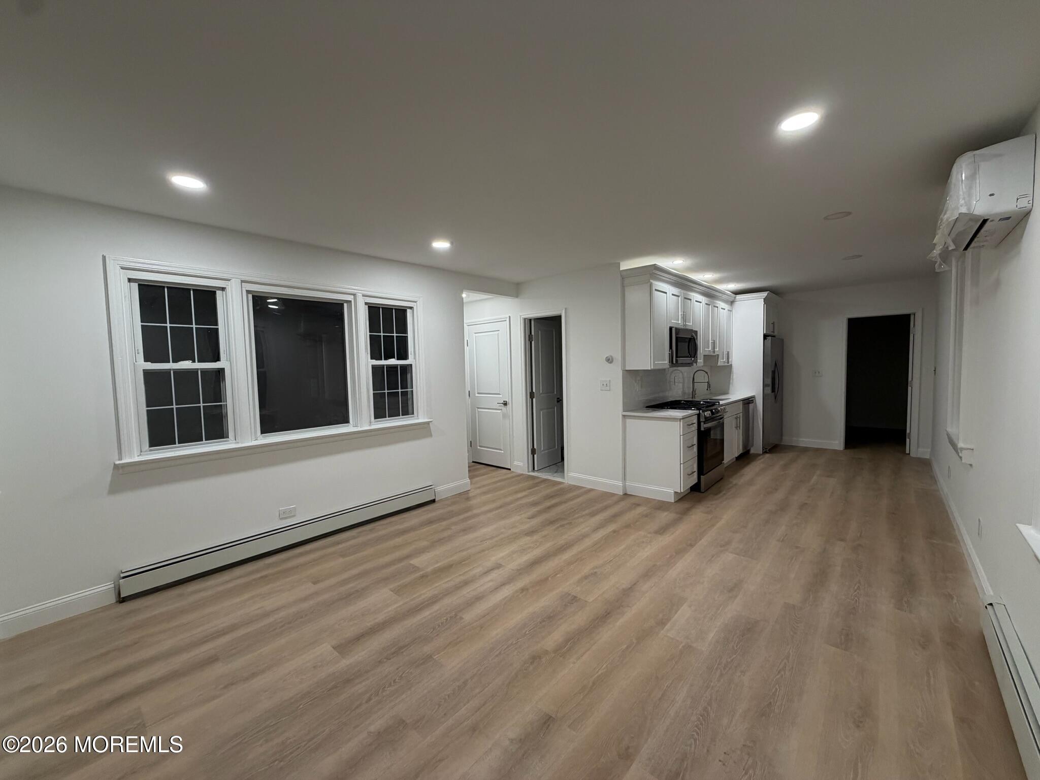 13 Pittenger Pond Road Freehold, NJ 07728 - Photo 4 of 16 a view of a kitchen with a sink and a window