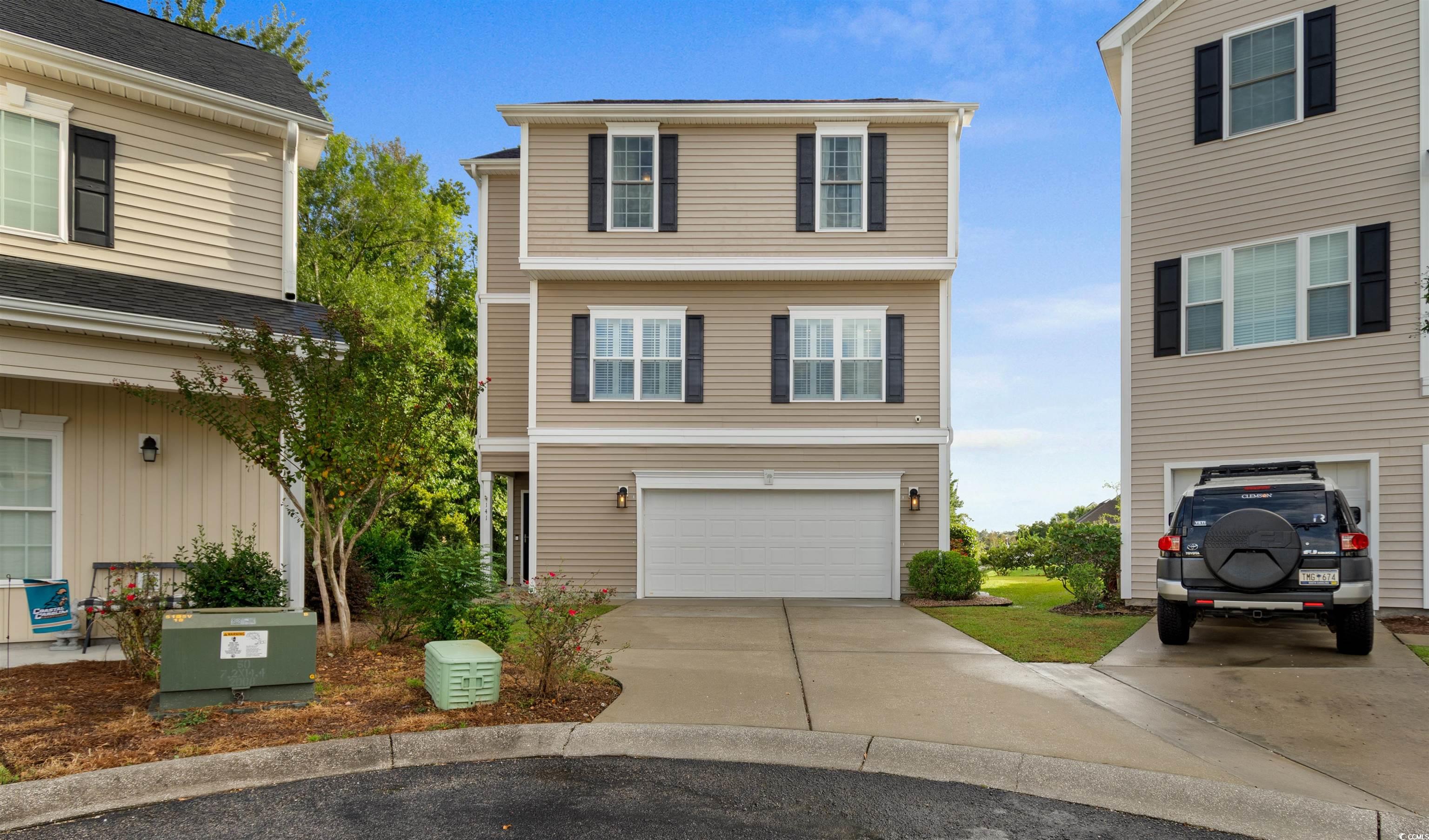 141 Terracina Circle Myrtle Beach, SC 29588 - Photo 1 of 40 View of front facade with a garage